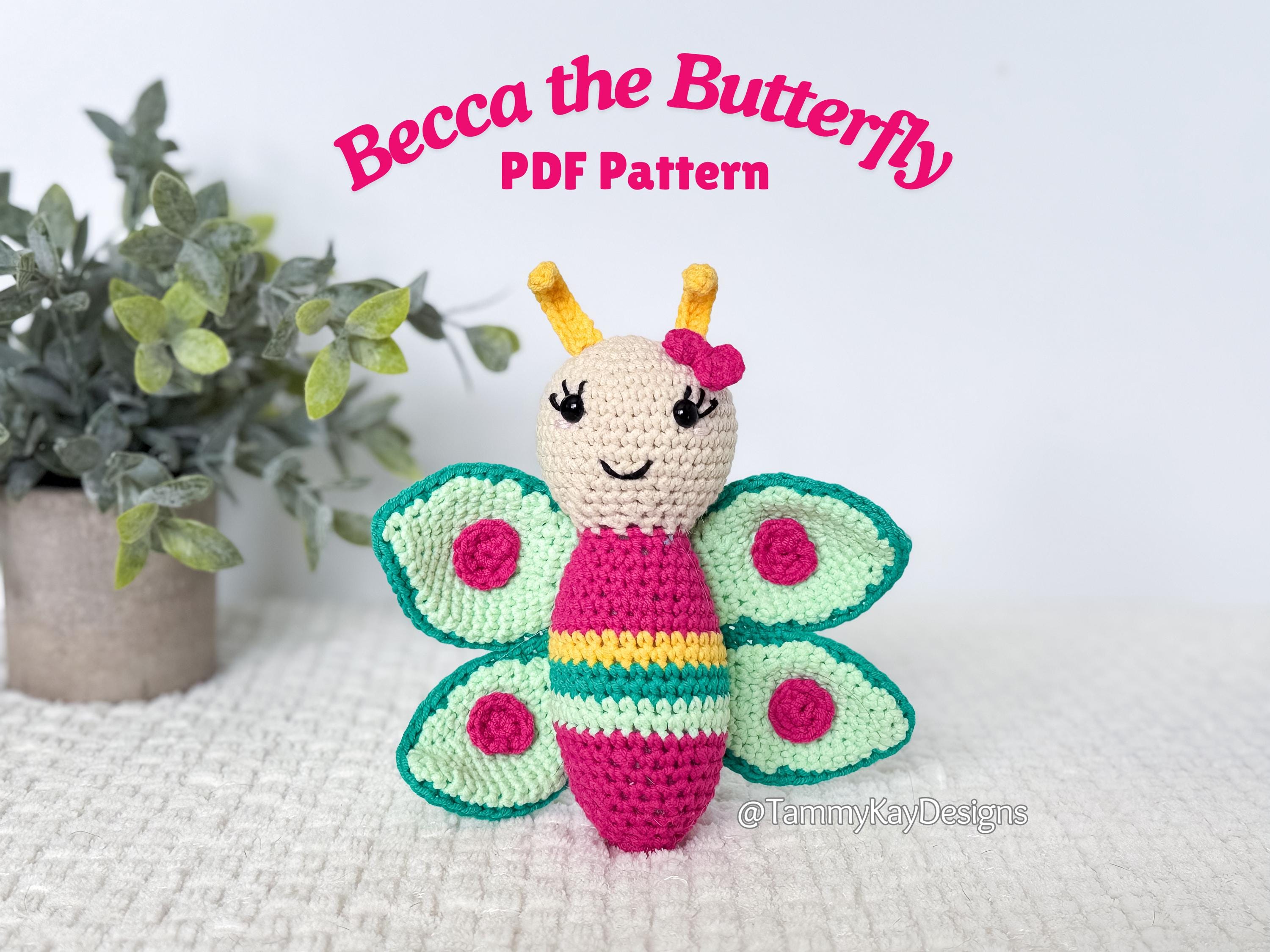 Crocheted butterfly toy with 'Becca the Butterfly PDF Pattern' text on a white background.